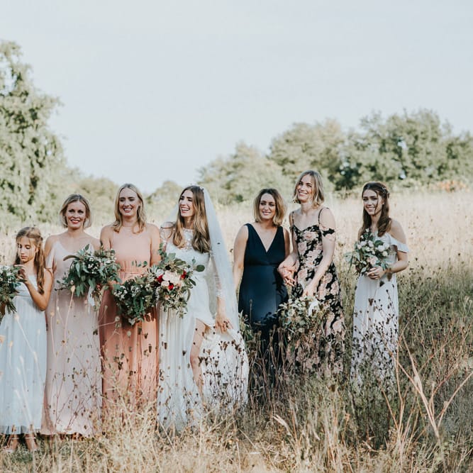 Bridal Party In Peach And Ink Coloured Dresses By Rewritten And Reformation