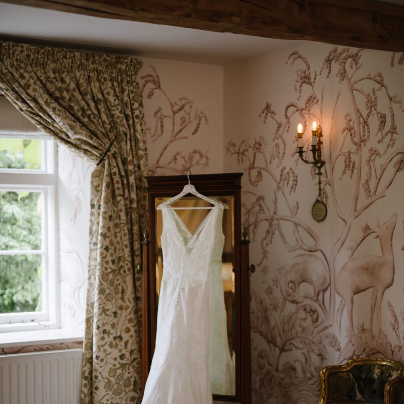 Lace Cymbeline Paris Wedding Dress Hanging Up