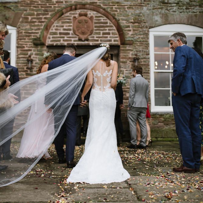 Brides Cathedral Length Veil Blowing in the Wind