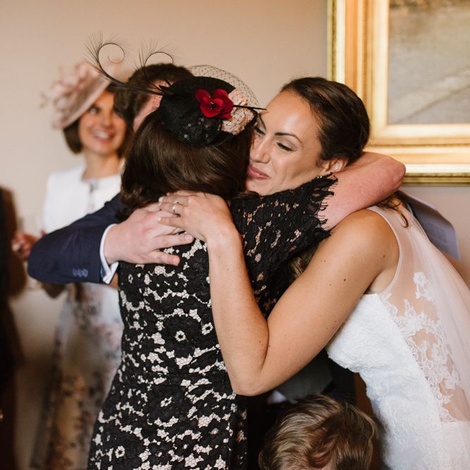 Bride and Wedding Guest Hugging