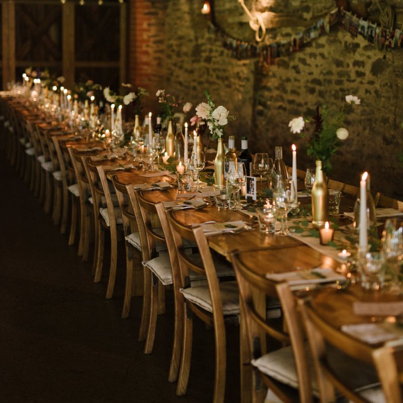 Long Tables with Candlelight and Flowers in Spray Painted Bottles