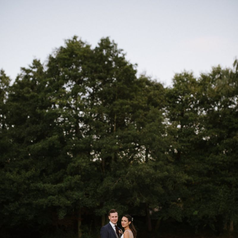 Bride and Groom Portrait on River Dock