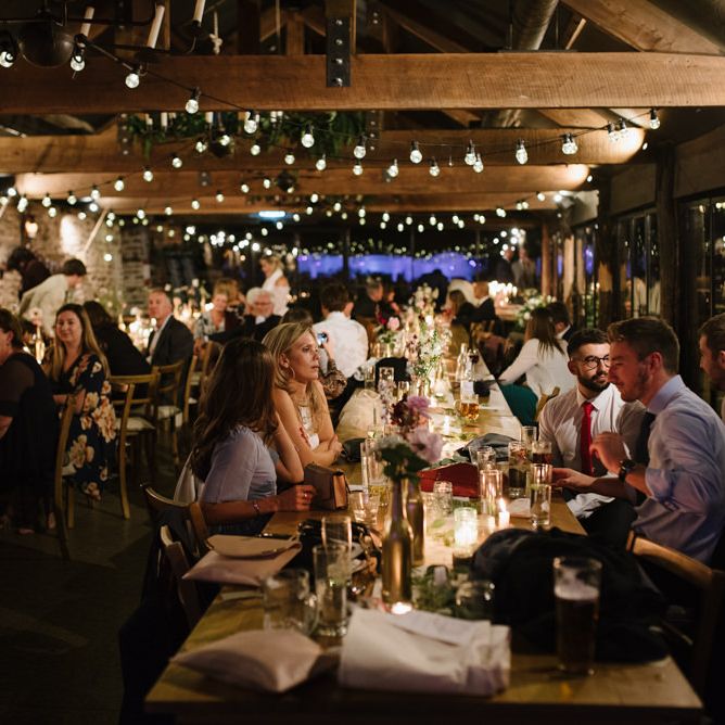Guests at Wedding Reception with Romantic Candle Light