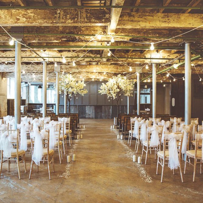 Ceremony Décor at Holmes Mill | Cherry Blossom Tree Altar | White Material Chair Sashes | Pillar Candles | Aisle Petals | Festoon Lights | Lace Bridal Cape Veil &amp; Fishtail Wedding Dress by Pronovias | On Love and Photography