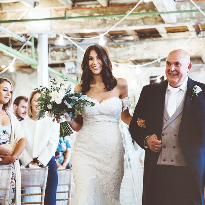 Entrance of the Bride | Bride in Embroidered Pronovias Wedding Dress with Off Shoulder Sleeves and Veil Cape | Bridal Bouquet of White Roses and Greenery | Father of the Bride in Navy Tails, Grey Waistcoat and White Tie | Bride Wearing Hair Down | Lace Bridal Cape Veil &amp; Fishtail Wedding Dress by Pronovias | On Love and Photography