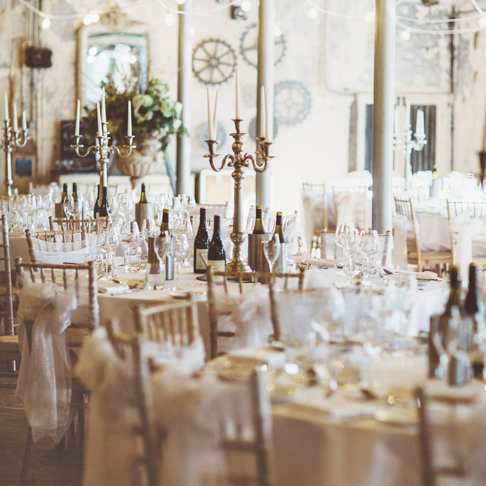 Wedding Reception Décor | Gold Candelabras | White Tapered Candles | White Material Chair Sashes | Festoon Lights | Oversized Floral Urn | Lace Bridal Cape Veil &amp; Fishtail Wedding Dress by Pronovias | On Love and Photography
