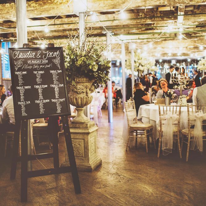 Wedding Reception Décor | Oversized Floral Urn | Festoon Lights | White Material Chair Sashes | Lace Bridal Cape Veil &amp; Fishtail Wedding Dress by Pronovias | On Love and Photography