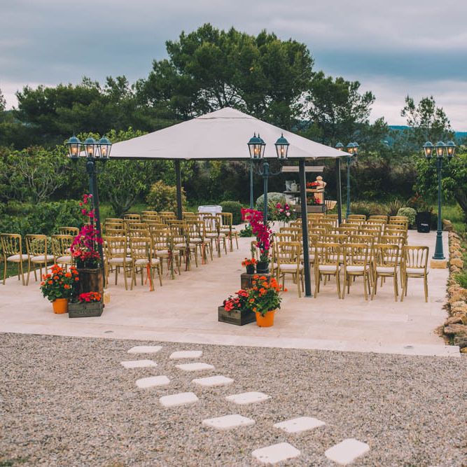 Outdoor Wedding Ceremony In South Of France With Bright Florals To Match Flower Crown