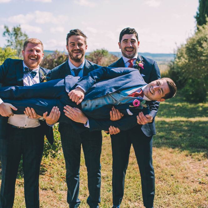 Groomsmen Carry The Groom
