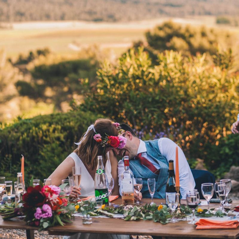 Bride In Flower Crown and Groom In Front Of Amazing View