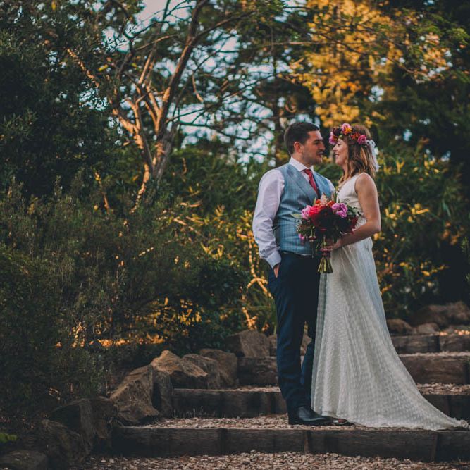Bride and Groom In French Villa Grounds With Flower Crown For Bride