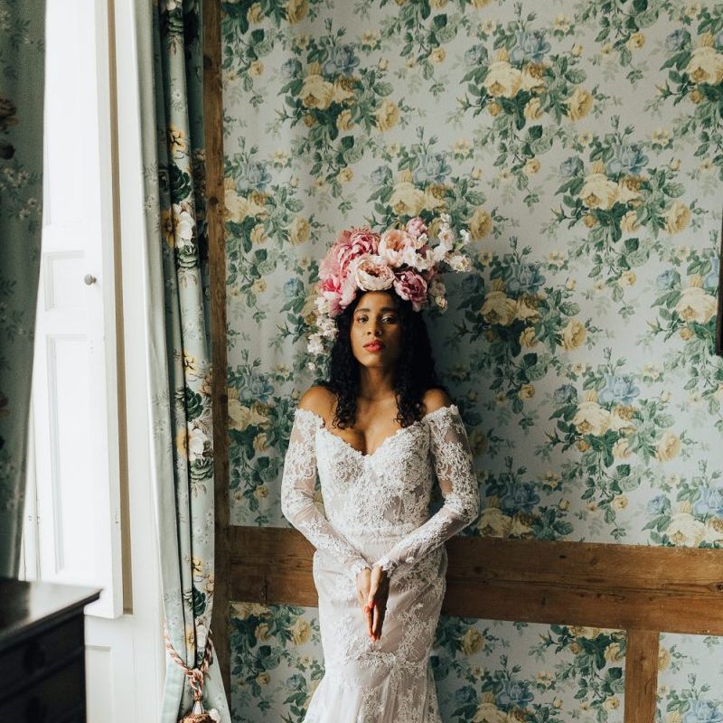 Lace off the shoulder wedding dress at Chiddingstone Castle
