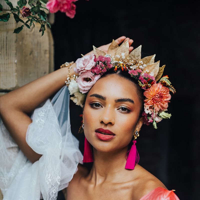 Beautiful black bride with colourful flower crown and tassel earrings
