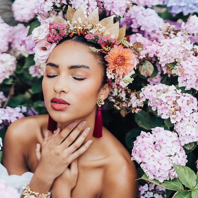 bride with pink tassel earrings and gold highlighter eyeshadow