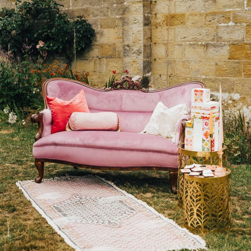 Pink velvet couch chill out area