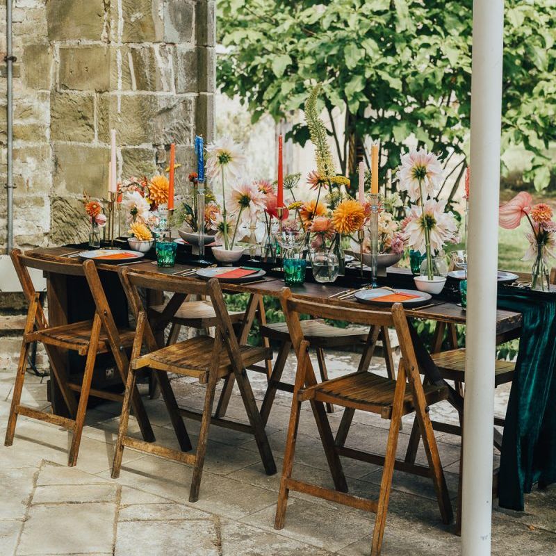 Chiddingstone Castle wedding reception table decor with colourful flowers