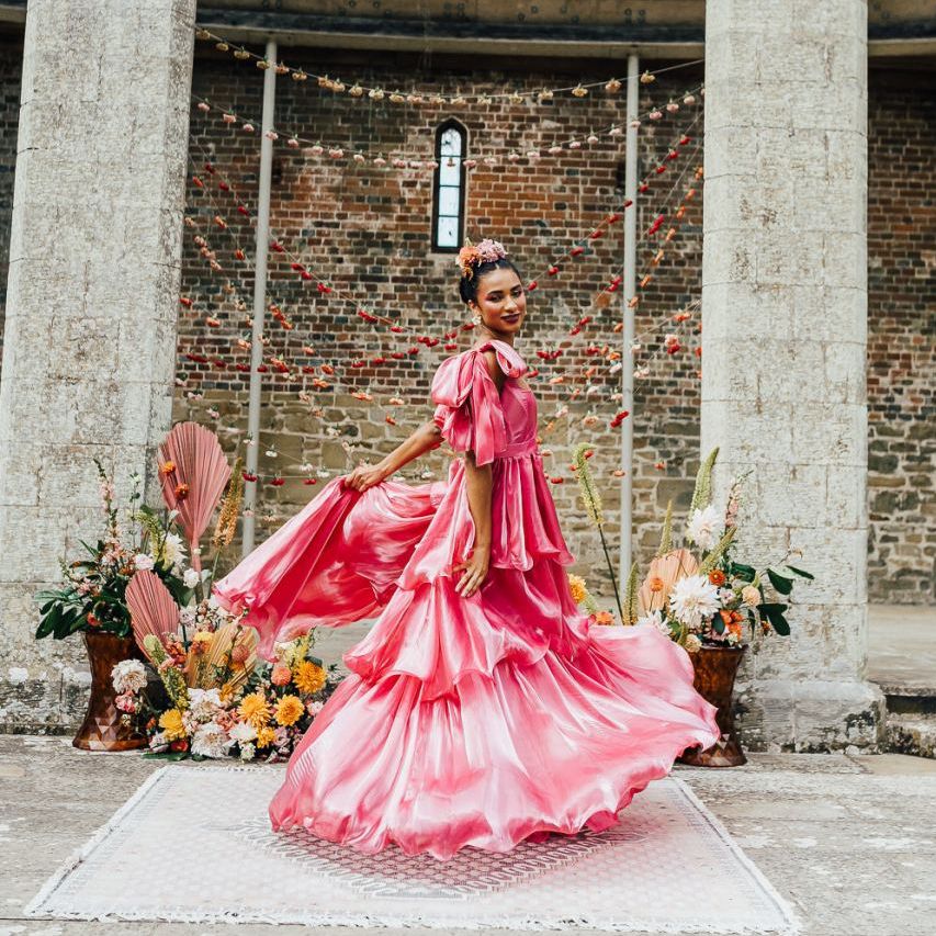 bride in layered silk Emma Beaumont wedding dress at Chiddingstone Castle