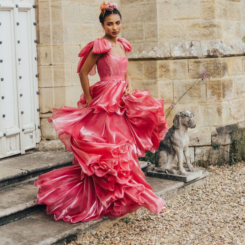bride in pink coloured wedding dress at Chiddingstone Castle