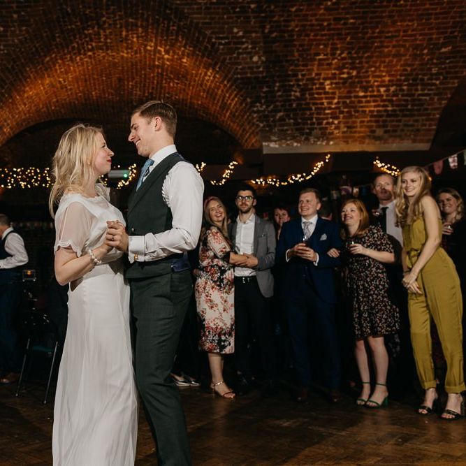 Bride and grooms first dance and  colourful reception with bright and fun decor in London