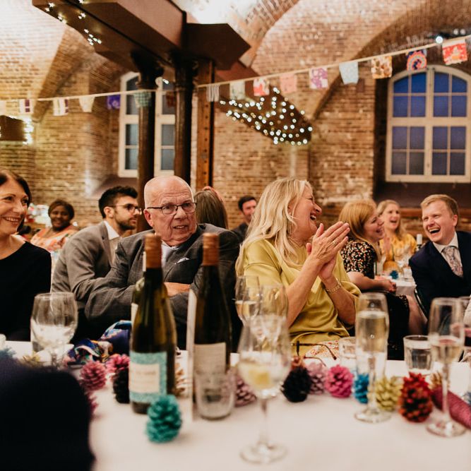 Hand painted pine cone wedding decor and homemade bunting from vintage scarves