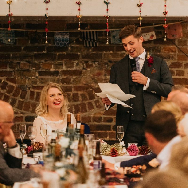 Grooms speech at colourful reception with bright and fun decor
