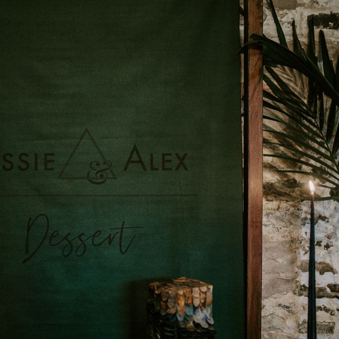 Forest Green Flag Backdrop with Geometric Design | Forest Green and Black Dark Decadence Wedding Inspiration in a Rustic Barn Planned &amp; Styled by Knots &amp; Kisses with Images by Daze of Glory Photography