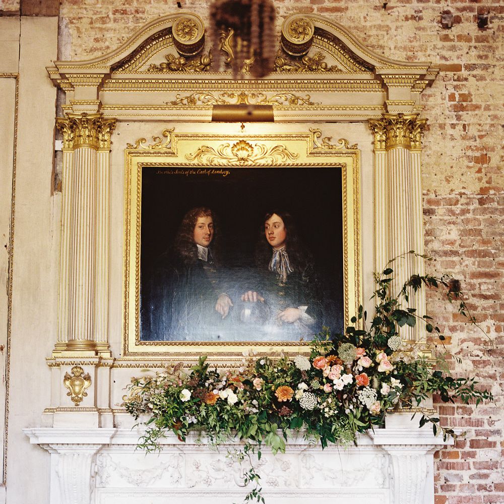 Living Coral, White &amp; Greenery Fireplace Mantel Wedding Flowers | Elegant Summer Inspiration at St Giles House, Dorset by Jessica Roberts Design   Imogen Xiana Photography