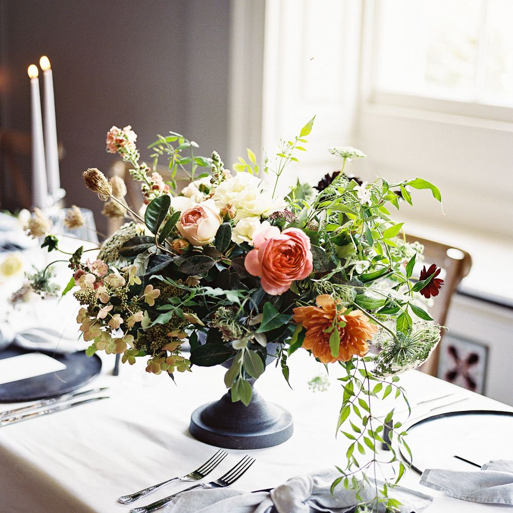 Living Coral, White &amp; Greenery Floral Centrepieces | Elegant Summer Inspiration at St Giles House, Dorset by Jessica Roberts Design | Imogen Xiana Photography