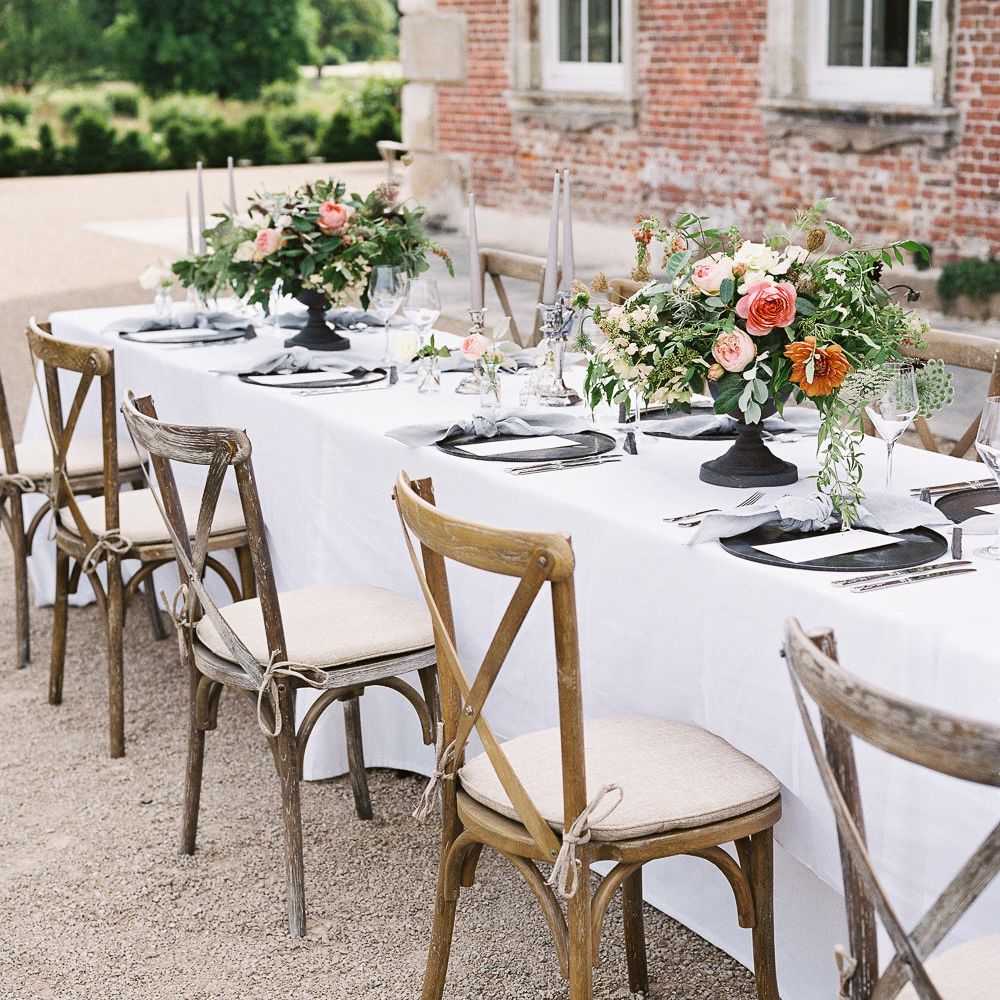 Outdoor Tablescape with Living Coral, White &amp; Greenery Floral Centrepieces | Elegant Summer Inspiration at St Giles House, Dorset by Jessica Roberts Design   Imogen Xiana Photography