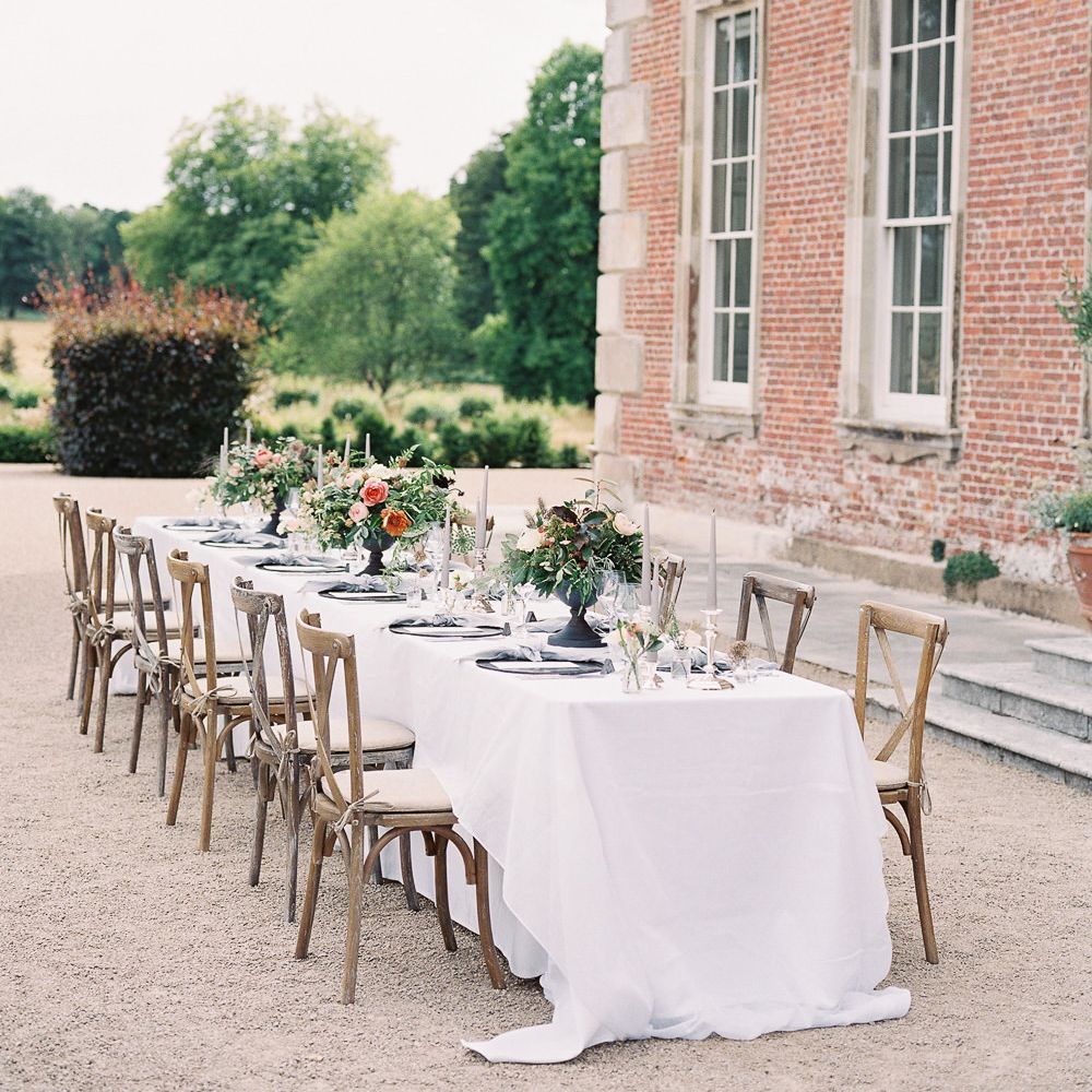 Outdoor Tablescape with Living Coral, White &amp; Greenery Floral Centrepieces | Elegant Summer Inspiration at St Giles House, Dorset by Jessica Roberts Design   Imogen Xiana Photography