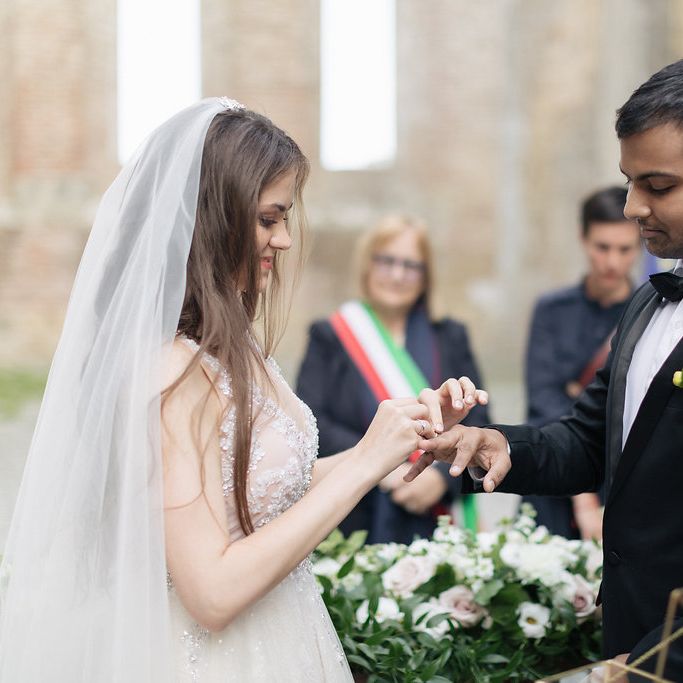 Bride and Groom Exchanging Rings During Wedding Ceremony