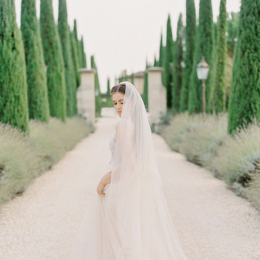 Bride in a Rara Avis Wedding Dress with Long Tulle Wedding Veil