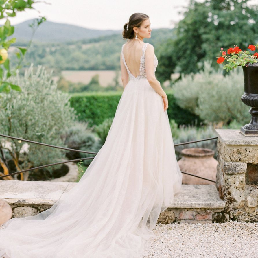 Bride in a Backless Rara Avis Wedding Dress with Tulle Skirt