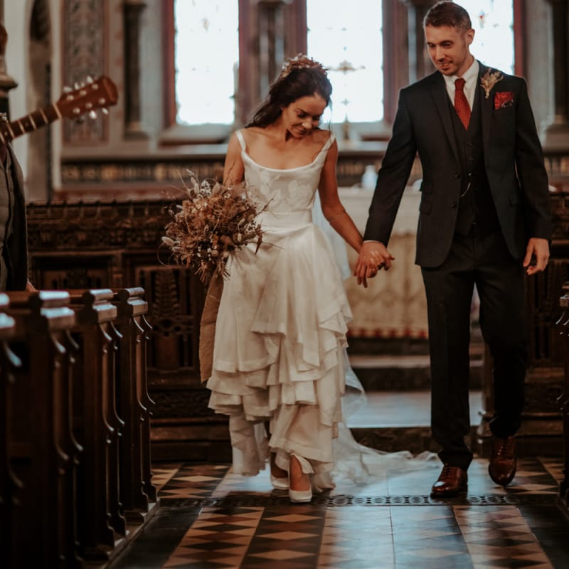 Bride and groom, walking down the aisle as husband and wife