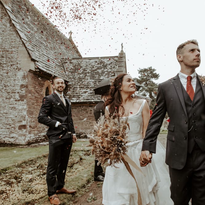 Bride and groom in the churchyard at September 2020 wedding
