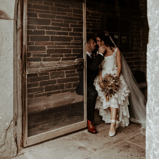 Bride in high low Vivienne Westwood inspired wedding dress