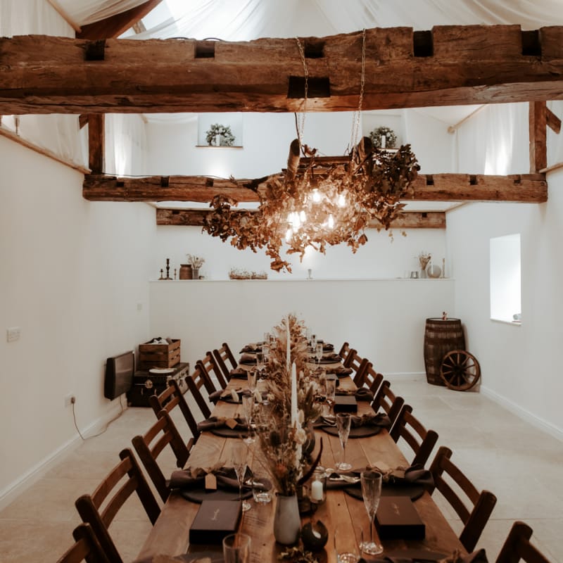 Intimate wedding reception with Autumnal wedding decor for September 2020 wedding