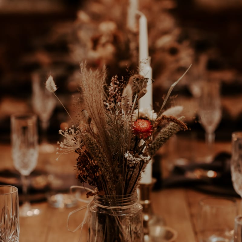 Dried flowers and grasses in jars for September 2020 wedding