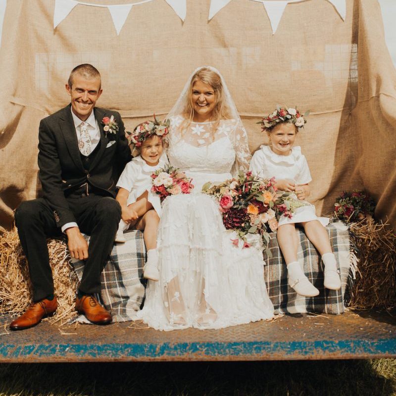Family portrait with bride in Eliza Jane Howell wedding dress