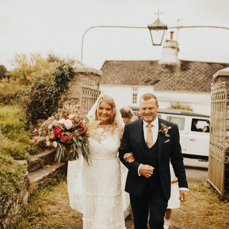 Bride in Eliza Jane Howell wedding dress arriving for church ceremony