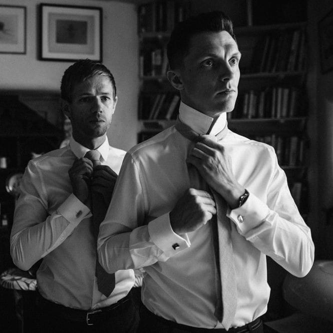 Groom's Party Getting Ready | Ivania Pronovias Wedding Dress with Long Sleeves and Minimalist Styling | Chris Barber Photography