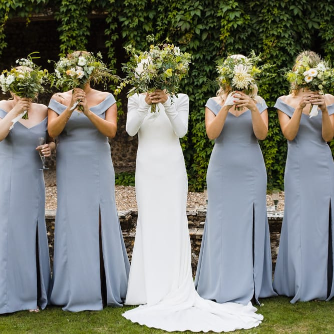 Bride in Long Sleeved Wedding Dress with Plunging V Back and Cuff Buttons by Pronovias | Bridal Up Do | Bridesmaids in Grey Off Shoulder Dessy Dresses with Side Split | Bouquets of Scabious, Ammi Majus, Veronica, Snowberries, Chocolate Cosmos, Black Scabious, Cafe au Lait Dahlias and Majolica Spray Roses with White Trailing Ribbon | Ivania Pronovias Wedding Dress with Long Sleeves and Minimalist Styling | Chris Barber Photography