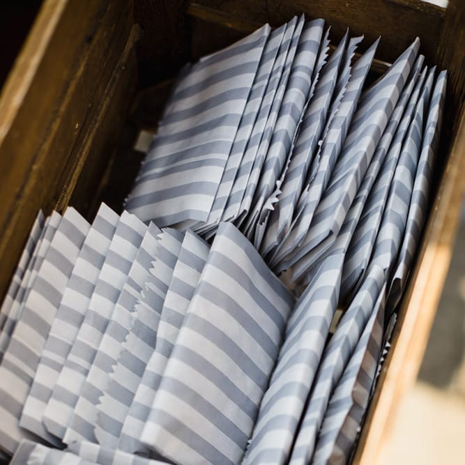 Grey and White Striped Sweet Bags in Crate | Ivania Pronovias Wedding Dress with Long Sleeves and Minimalist Styling | Chris Barber Photography