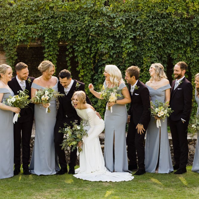 Bride in Long Sleeved Wedding Dress with Plunging V Back and Cuff Buttons by Pronovias | Bridesmaids in Grey Off Shoulder Dessy Dresses with Side Split | Groom and Groomsmen in Black Three Piece Suits with Grey Ties and Personalised Tie Clips | Bouquets of Scabious, Ammi Majus, Veronica, Snowberries, Chocolate Cosmos, Black Scabious, Cafe au Lait Dahlias and Majolica Spray Roses with White Trailing Ribbon | Ivania Pronovias Wedding Dress with Long Sleeves and Minimalist Styling | Chris Barber Photography