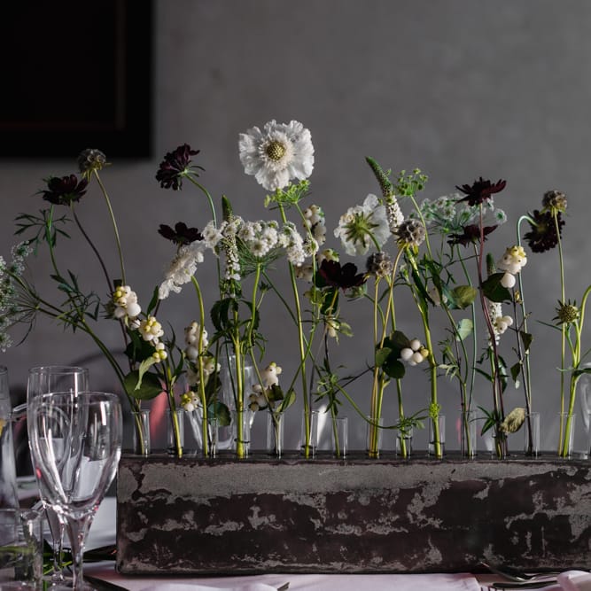 Table Flowers in Concrete Single Stem Vessels | Ivania Pronovias Wedding Dress with Long Sleeves and Minimalist Styling | Chris Barber Photography