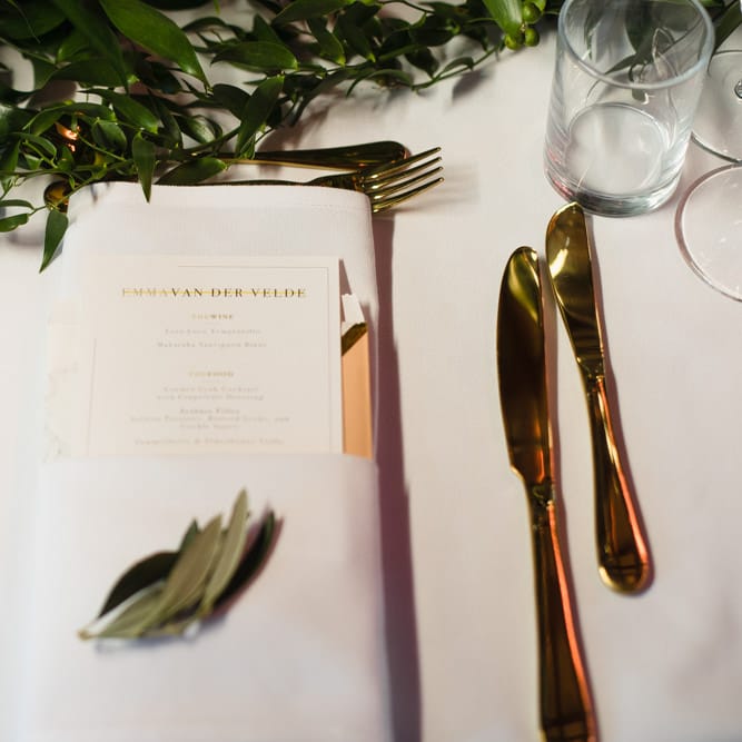 Gold Cutlery | Personalised Wedding Breakfast Menu | Eucalyptus Table Runner | Ivania Pronovias Wedding Dress with Long Sleeves and Minimalist Styling | Chris Barber Photography