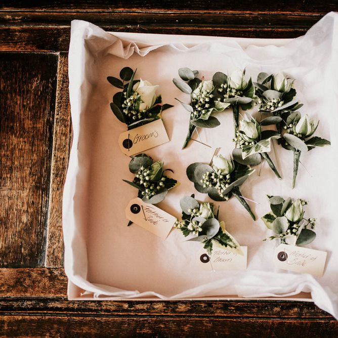 Green and White Buttonholes