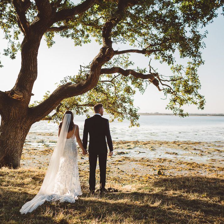 Bride and groom wearing Made With Love Bridal Dress at intimate wedding