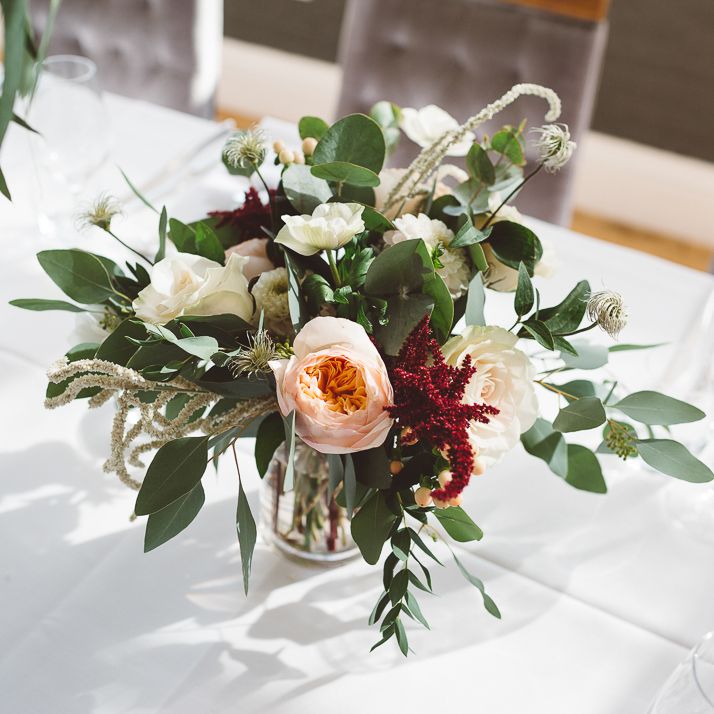 Beautiful floral table arrangements for intimate dinner reception