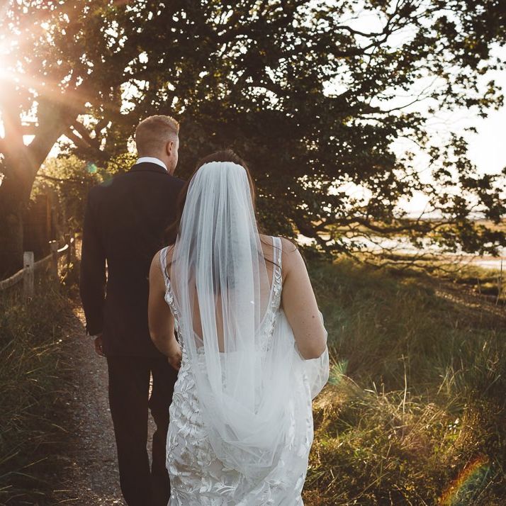 Bride and groom steal a moment together and enjoy golden hour